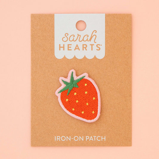Strawberry iron-on patch on a 'Sarah Hearts' branded card with a pink background