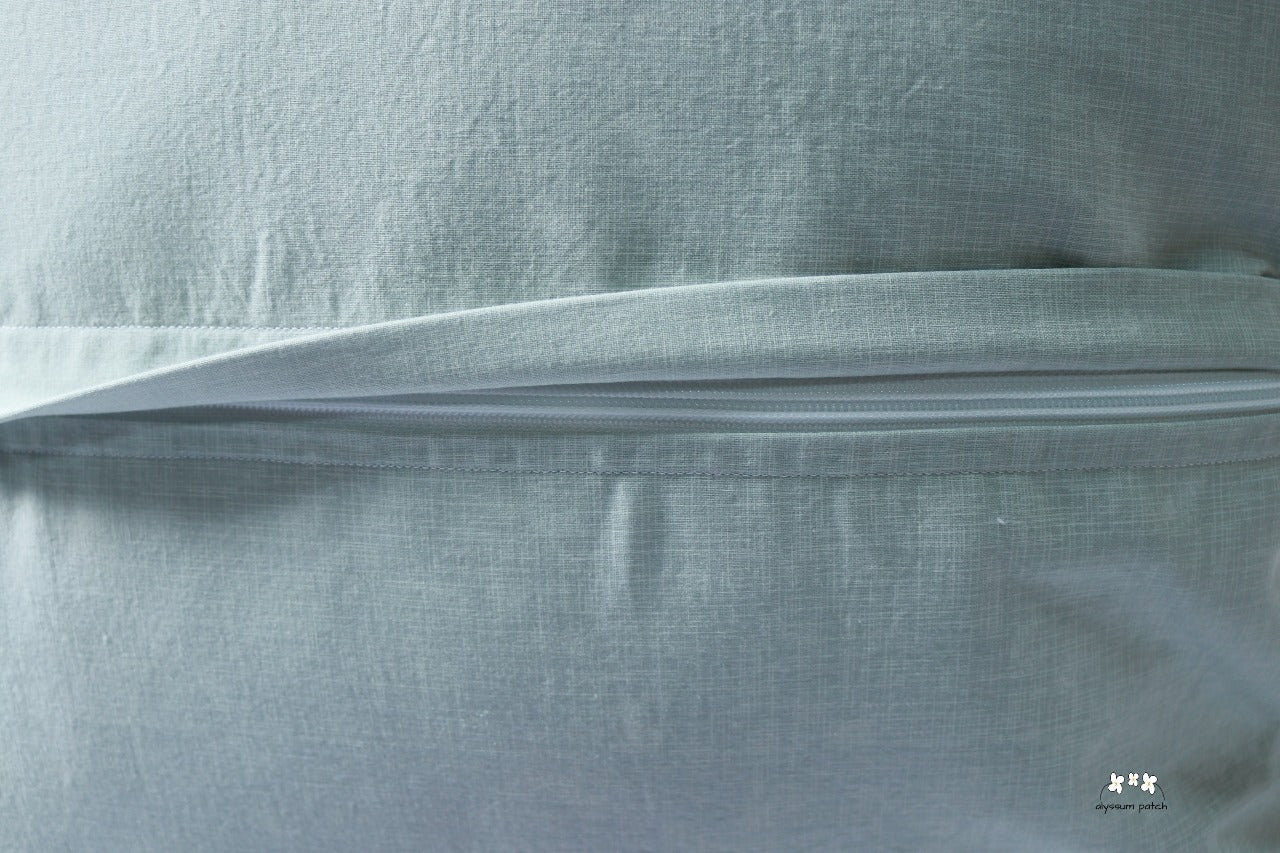 Close-up of zippered throw pillow backing