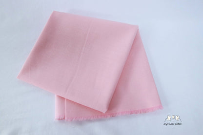 Kona Cotton Solids Baby Pink fabric folded