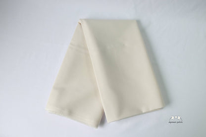 Kona Cotton Solids Bone fabric folded