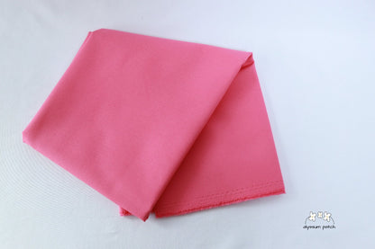 Kona Cotton Solids Camellia fabric folded