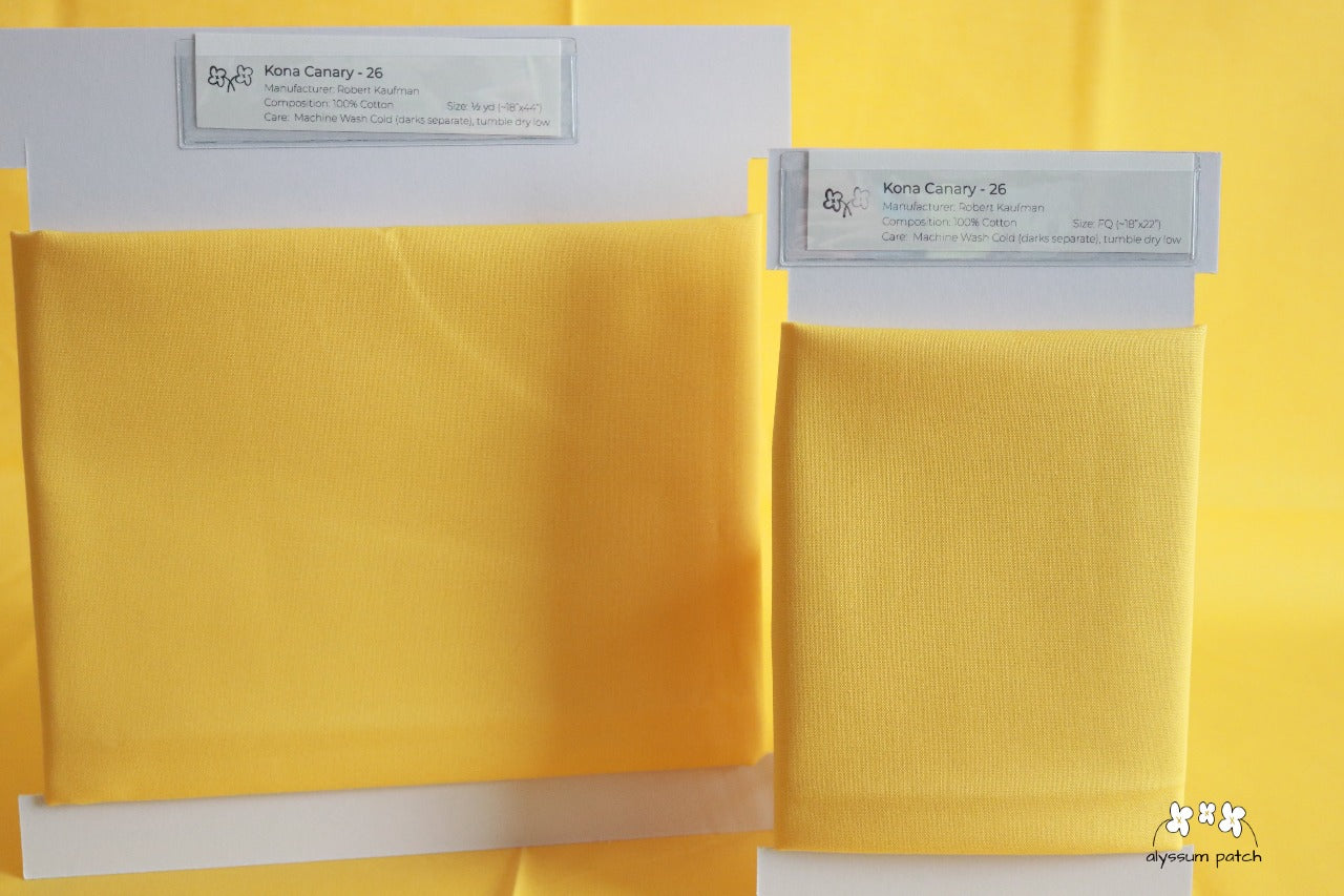 Kona Solids Canary precut fat quarter and half yard fabric wrapped on fabric winders