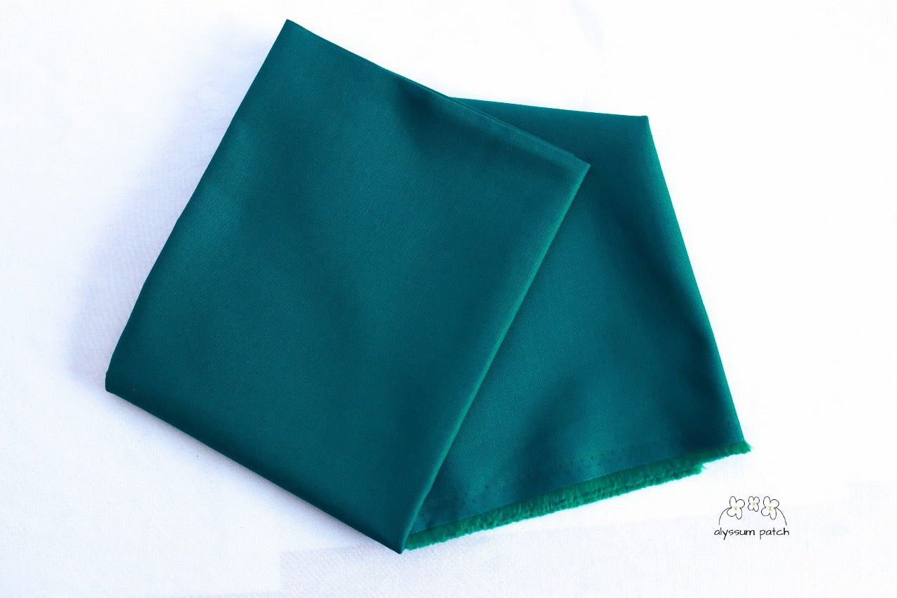 Kona Cotton Solids Emerald fabric folded