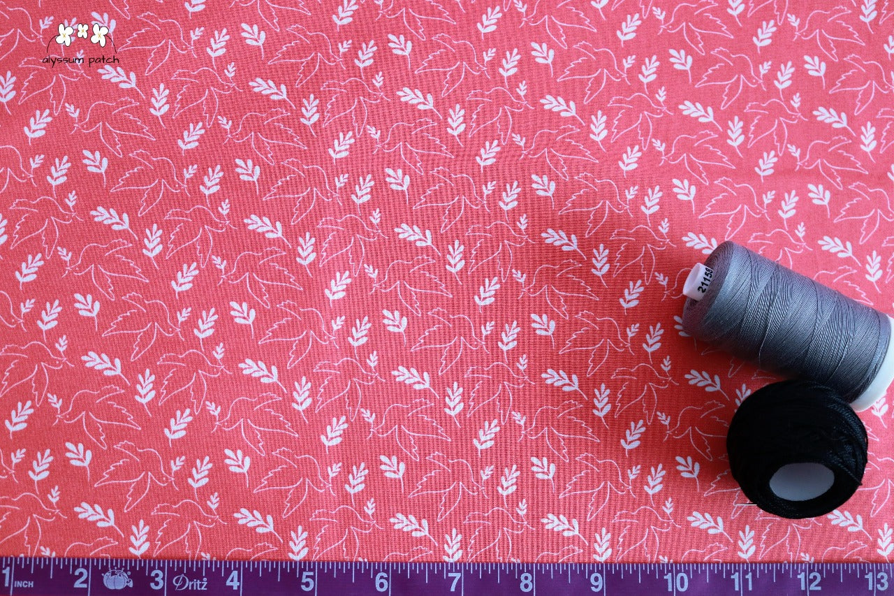 Giving Peace fabric with tape measurer and spools of thread to show scale of pattern image