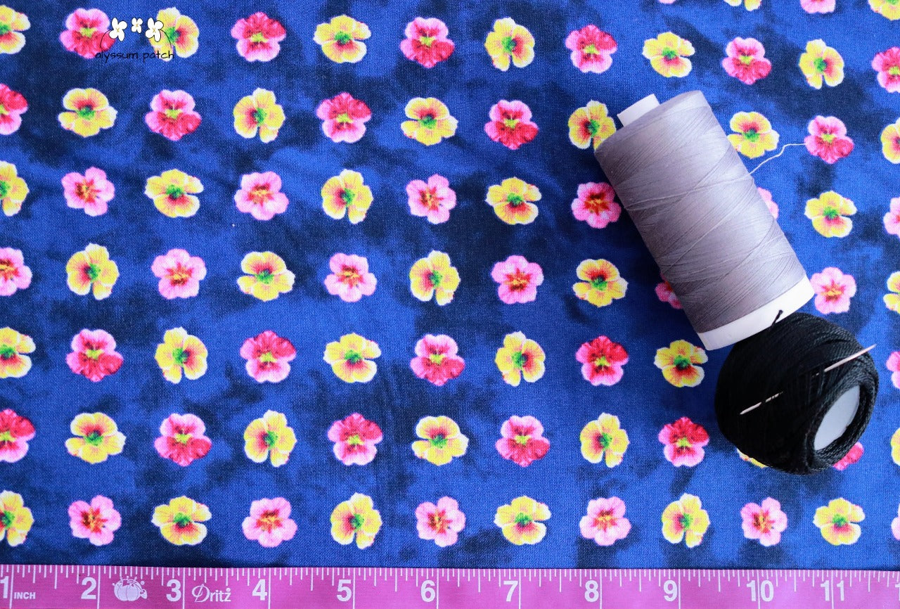 Hummingbird Heaven fabric with tape measurer and spools of thread to show scale of pattern image