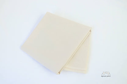 Kona Cotton Solids Ivory fabric folded