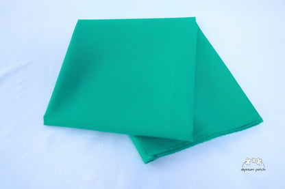 Kona Cotton Solids Kale fabric folded