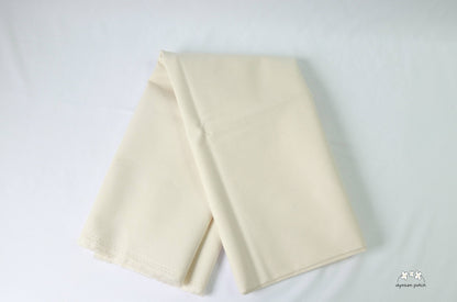 Kona Cotton Solids Natural fabric folded
