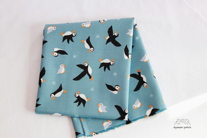 Puffins on Blue fabric folded
