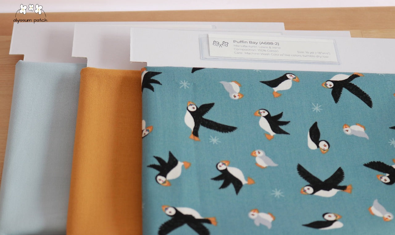 Puffins on Blue precut fabric paired with Kona Solids Yarrow and Kona Solids Blue