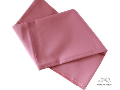 Kona Cotton Solids Rose fabric folded
