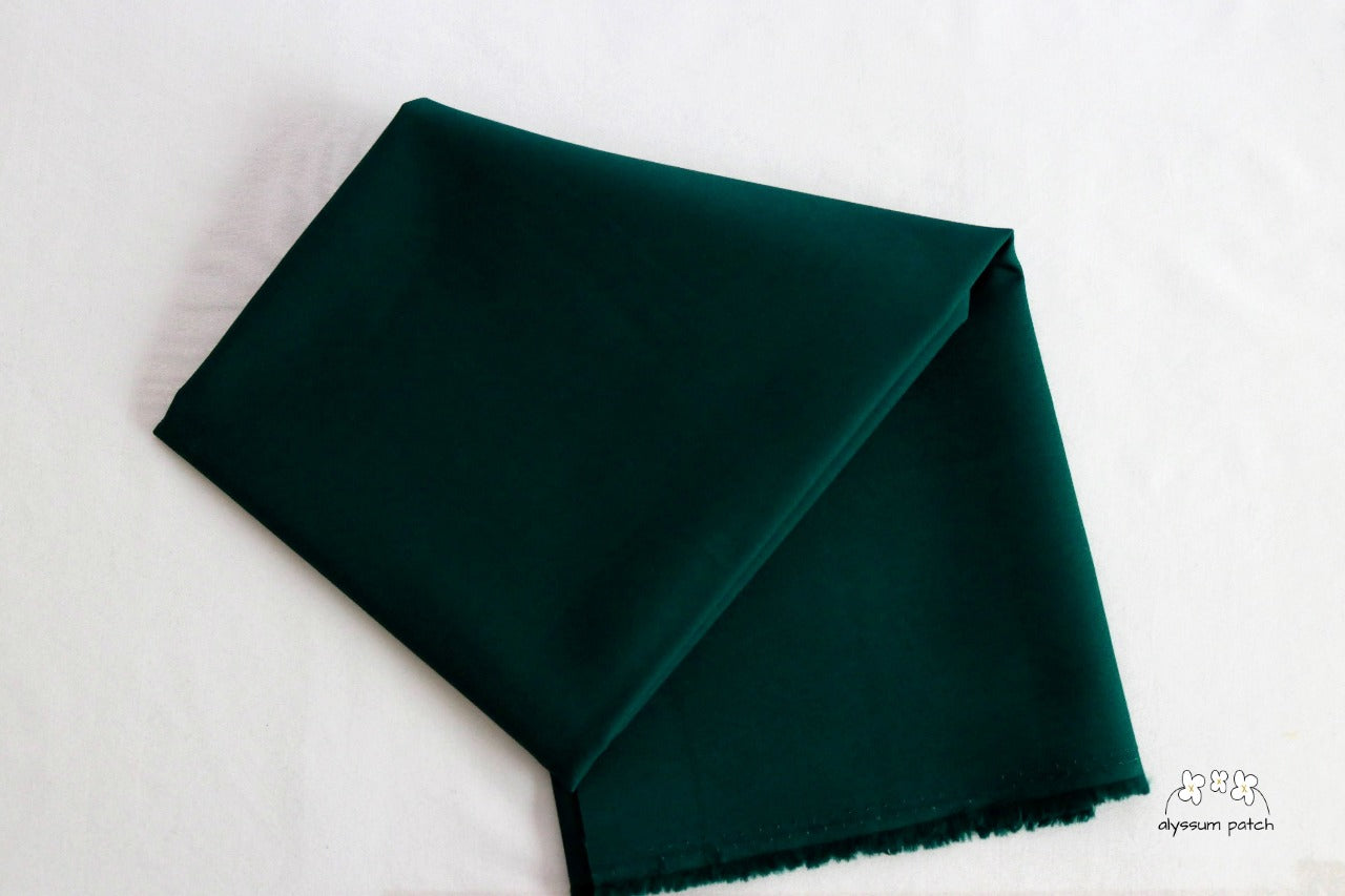 Kona Cotton Solids Spruce fabric folded
