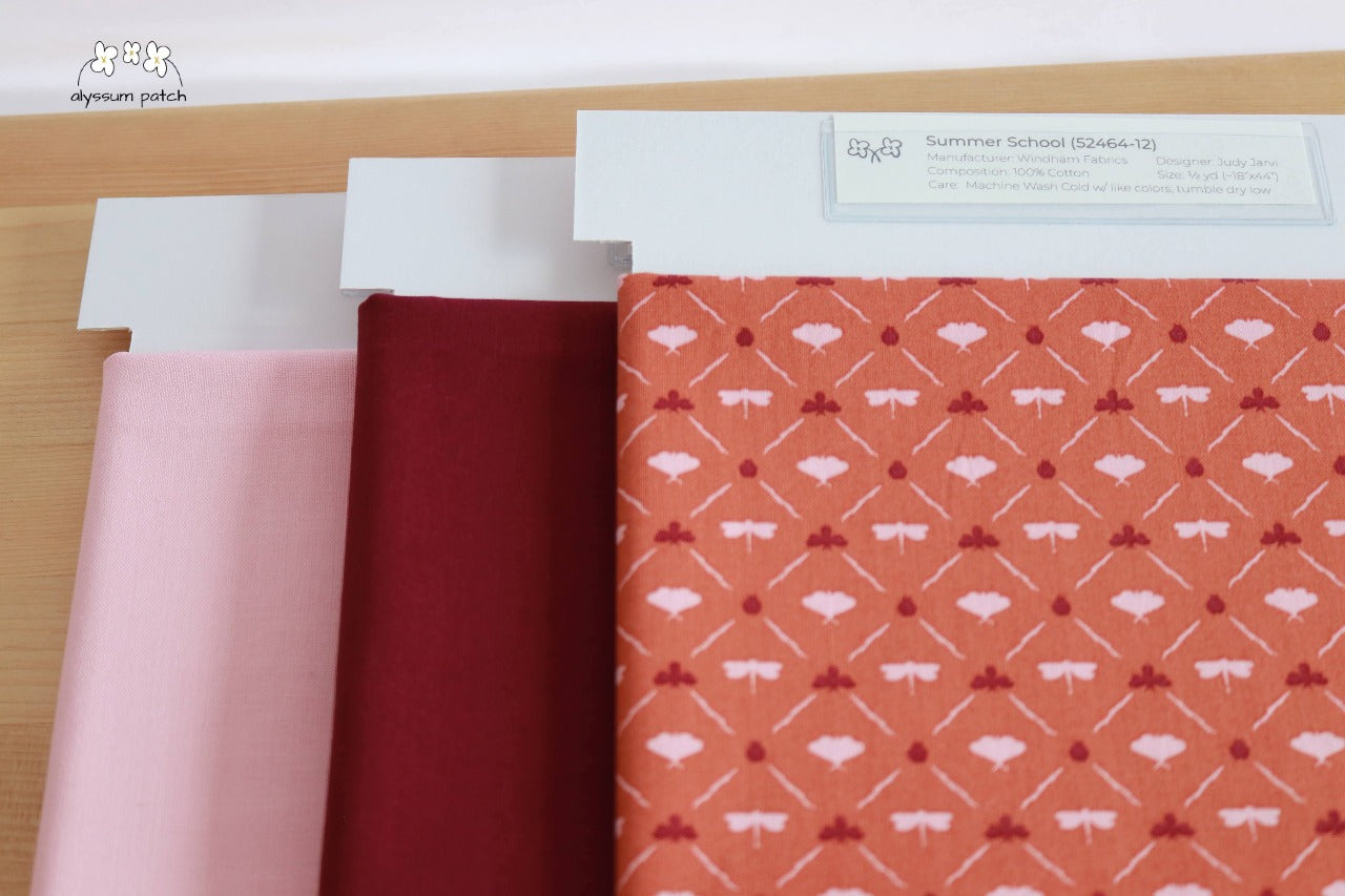 Summer School precut fabric paired with Kona Solids Bordeaux and Kona Cotton Baby Pink