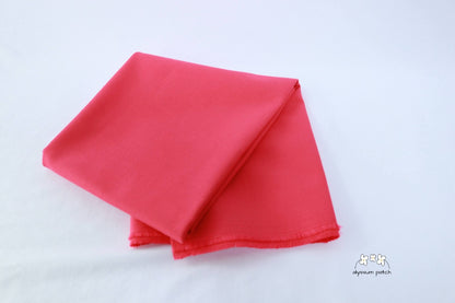 Kona Cotton Solids Watermelon fabric folded