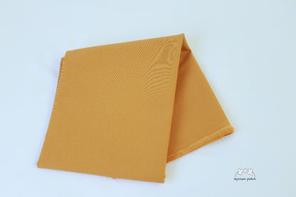 Kona Cotton Solids Yarrow fabric folded