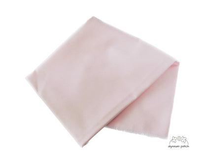 Kona Cotton Solids Ballet Slipper fabric folded