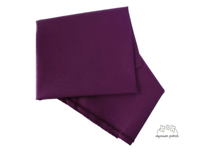 Kona Cotton Solids Eggplant fabric folded