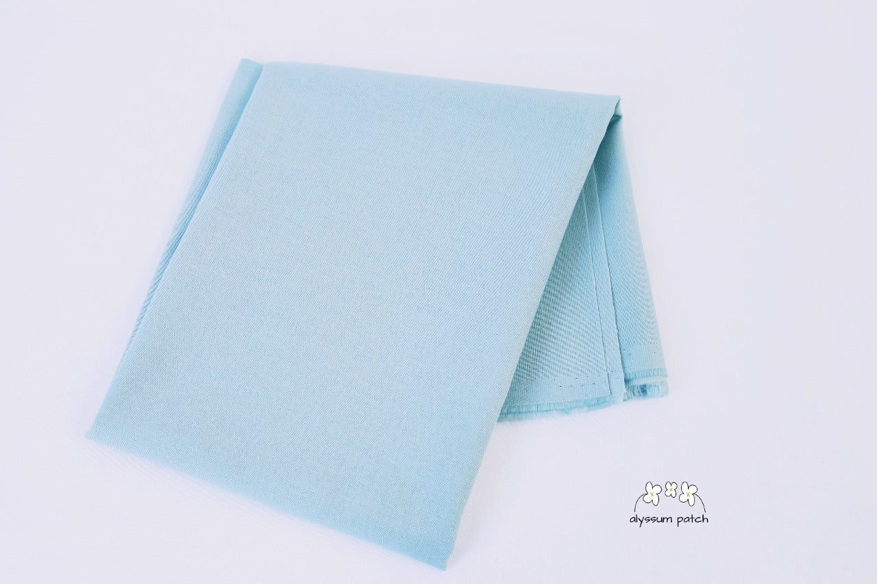 Kona Cotton Solids Fog fabric folded