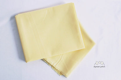 Kona Cotton Solids Maize fabric folded