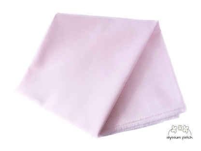 Kona Cotton Solids Pearl Pink fabric folded