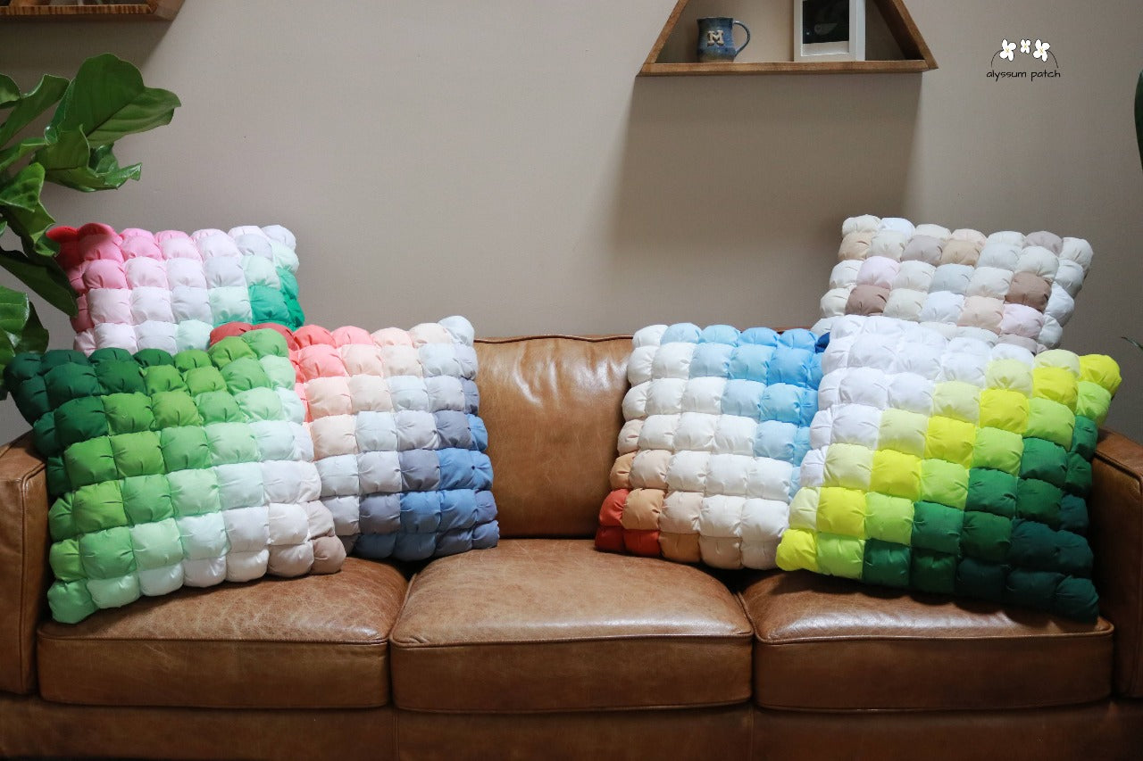 collection of patchwork puff throw pillows in different style variations