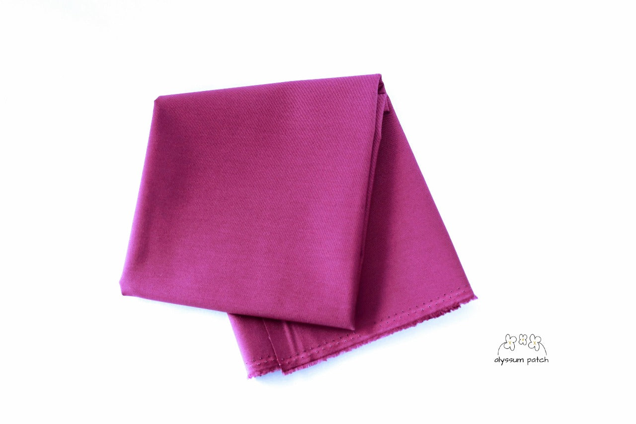 Kona Cotton Solids Plum fabric folded