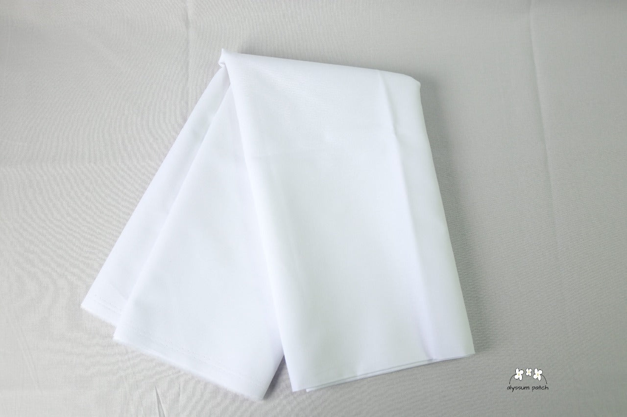 Kona Cotton Solids White fabric folded